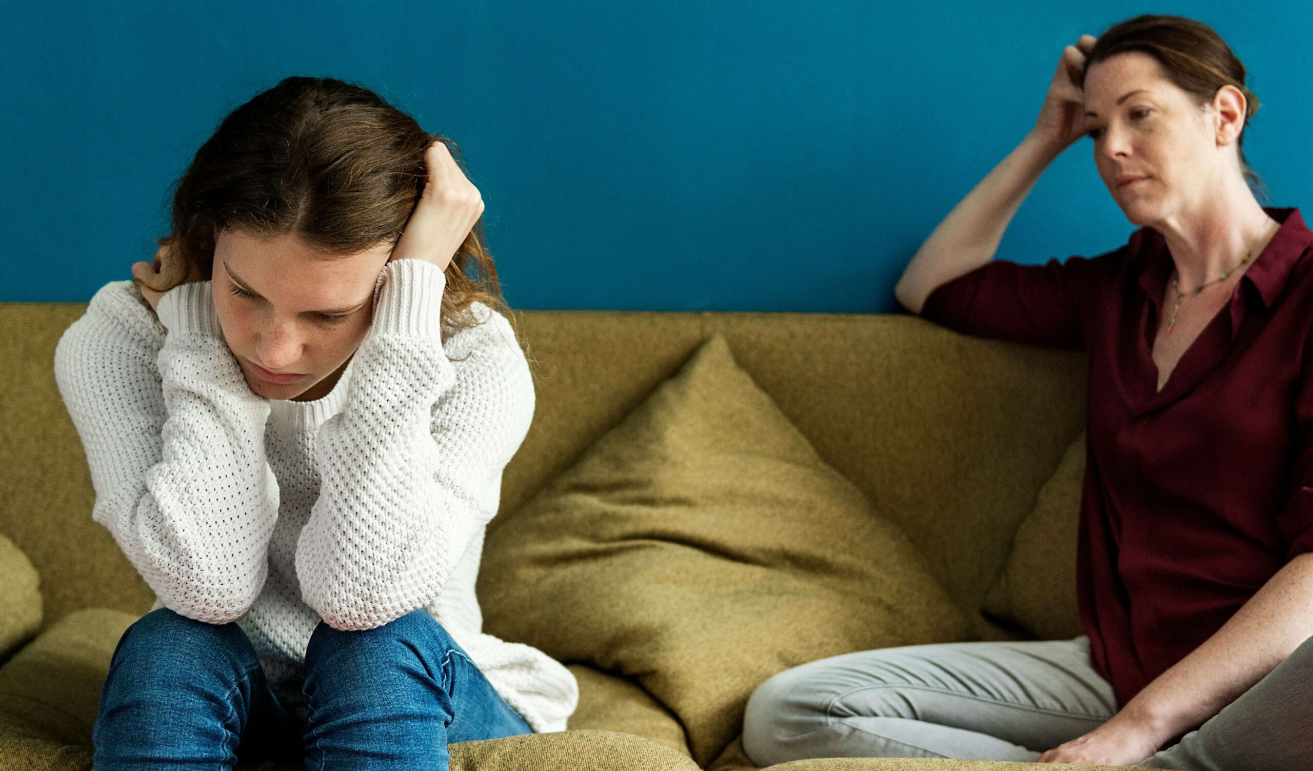 a mother and teenager having a difficult conversation